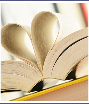 Open book pages form a heart shape